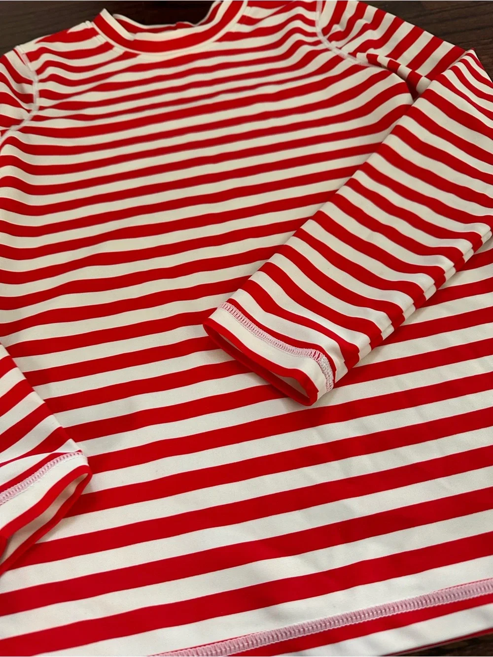 Primary long sleeve striped rash guard, size 8-9Y